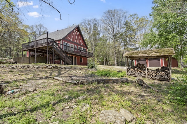 view of yard with a wooden deck and stairs