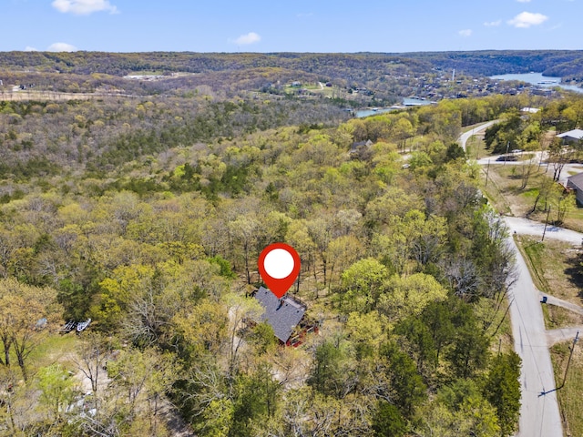 drone / aerial view featuring a view of trees