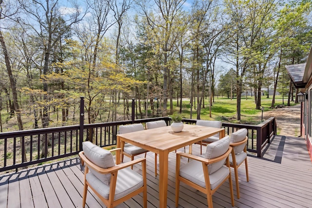 wooden terrace featuring outdoor dining area