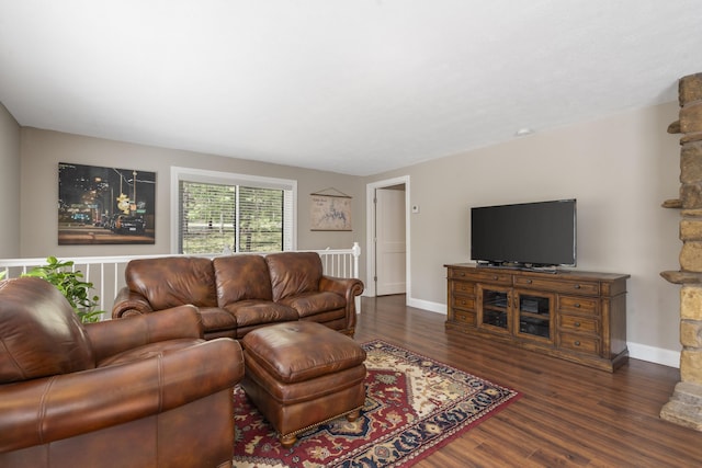 living area featuring wood finished floors and baseboards
