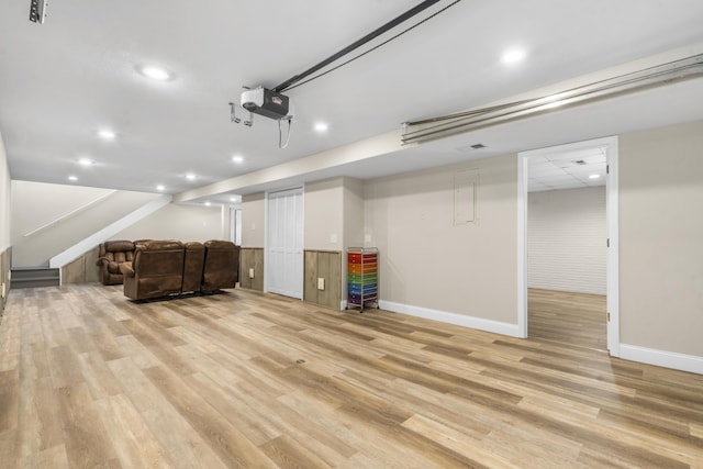 interior space featuring recessed lighting, baseboards, and a garage door opener