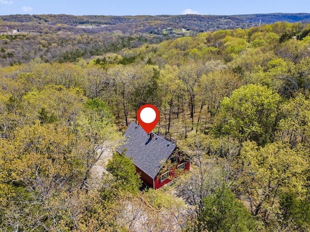 bird's eye view featuring a view of trees