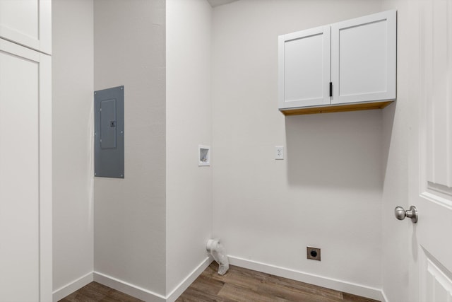 510 N Henry St, Mansfield, MO 65704 - laundry area with dark wood-style floors, electric panel, baseboards, electric dryer hookup, and cabinet space