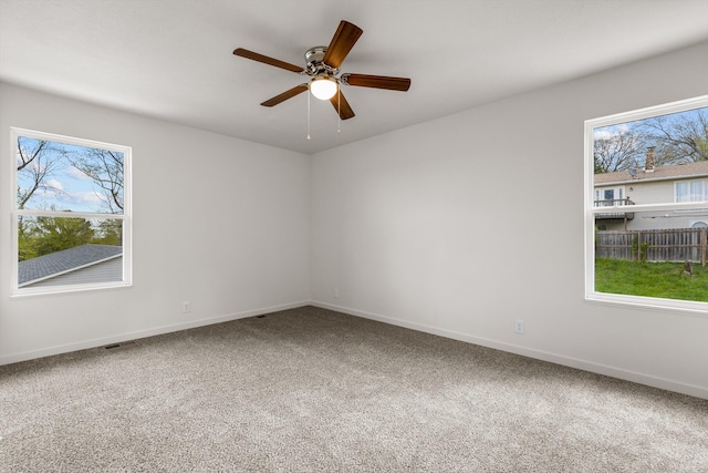 510 N Henry St, Mansfield, MO 65704 - empty room featuring plenty of natural light, baseboards, and carpet