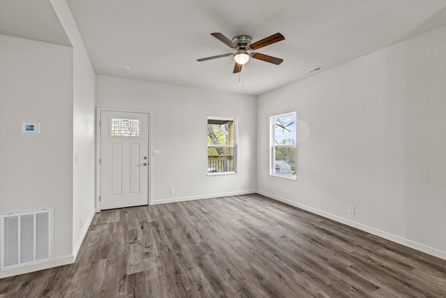 510 N Henry St, Mansfield, MO 65704 - entrance foyer with a healthy amount of sunlight, wood finished floors, and visible vents