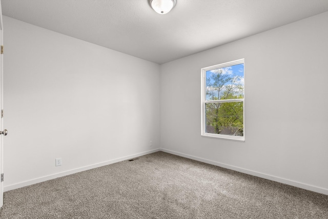510 N Henry St, Mansfield, MO 65704 - carpeted empty room with baseboards