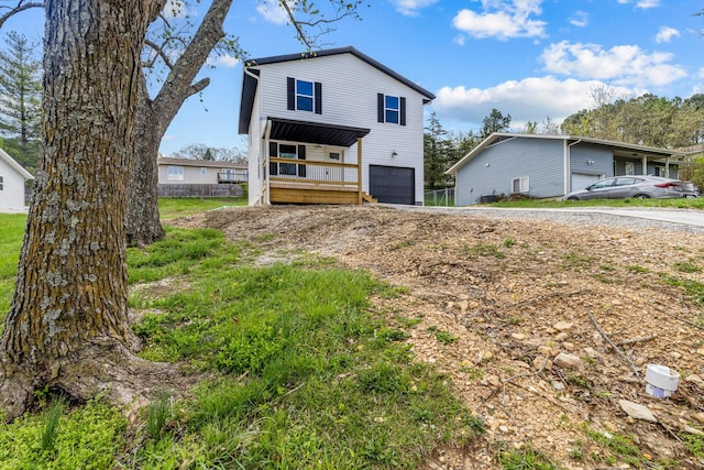 510 N Henry St, Mansfield, MO 65704 - exterior space with an attached garage and driveway