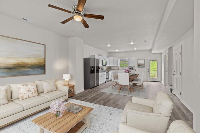 510 N Henry St, Mansfield, MO 65704 - living room featuring recessed lighting, wood finished floors, visible vents, baseboards, and ceiling fan