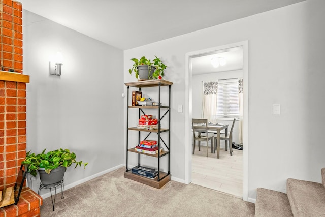 interior space with stairs, baseboards, and carpet