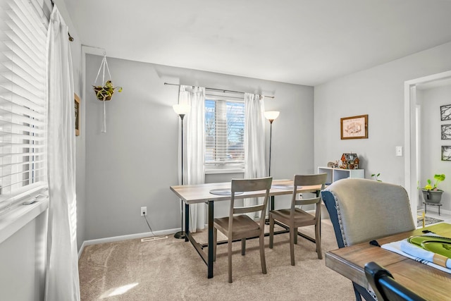 office area with baseboards and light carpet