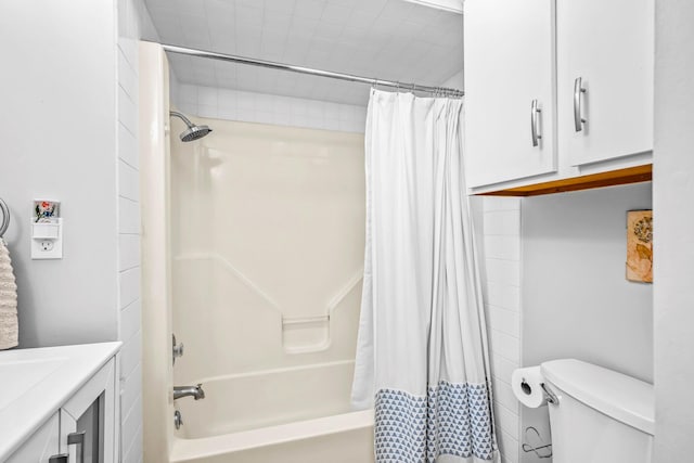 bathroom with vanity, toilet, and shower / bath combination with curtain