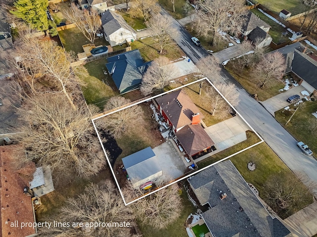 birds eye view of property with a residential view