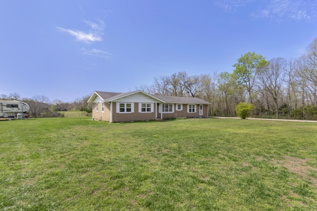 ranch-style house with a front yard