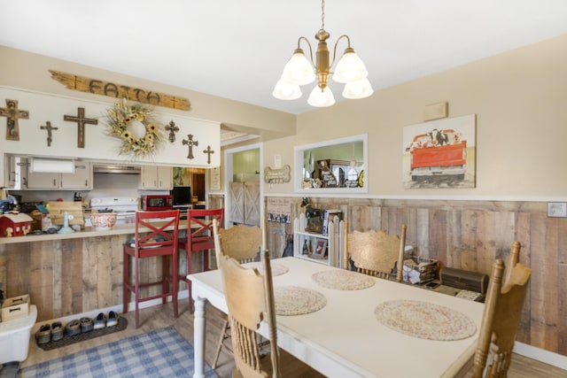 dining space featuring a chandelier