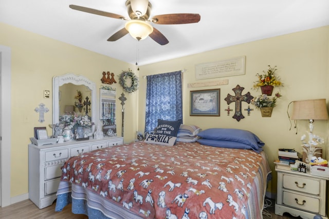 bedroom featuring wood finished floors and ceiling fan