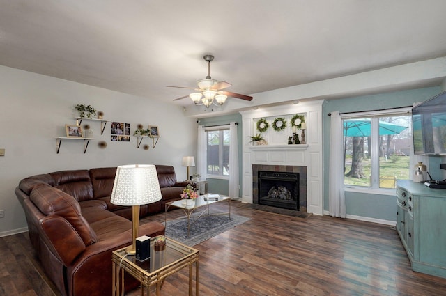 625 Parkwood Dr, Mount Vernon, MO 65712 - living area featuring ceiling fan, baseboards, dark wood-style floors, and a tiled fireplace