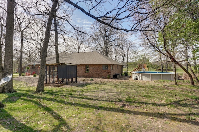 625 Parkwood Dr, Mount Vernon, MO 65712 - view of yard featuring central AC and an outdoor pool