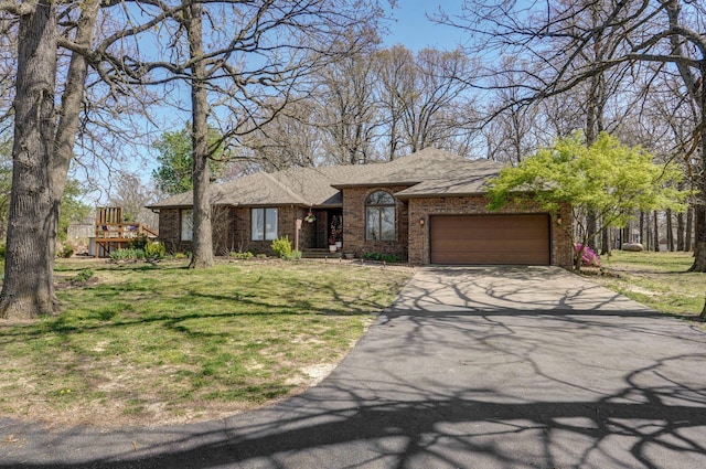 625 Parkwood Dr, Mount Vernon, MO 65712 - ranch-style house featuring a front lawn, driveway, brick siding, an attached garage, and a shingled roof
