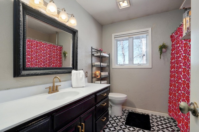 625 Parkwood Dr, Mount Vernon, MO 65712 - bathroom with toilet, vanity, and baseboards