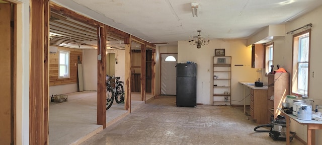 interior space with a wealth of natural light and a notable chandelier