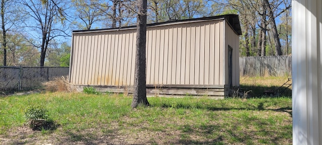 view of outdoor structure with fence