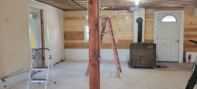 entryway with wood walls