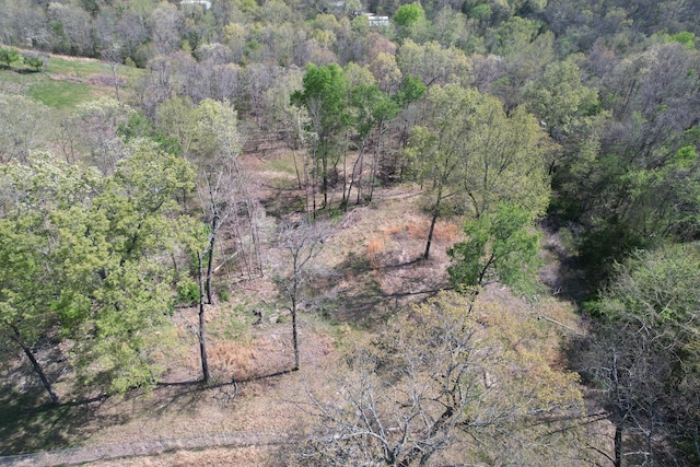 aerial view featuring a wooded view