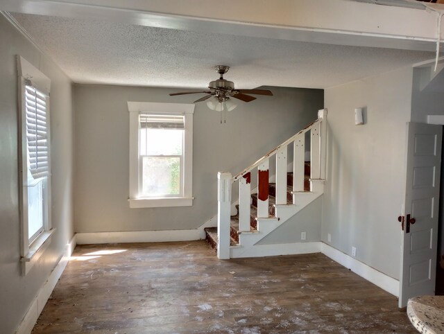 215 N Central Ave, Monett, MO 65708 - stairs featuring hardwood / wood-style floors, baseboards, and ceiling fan