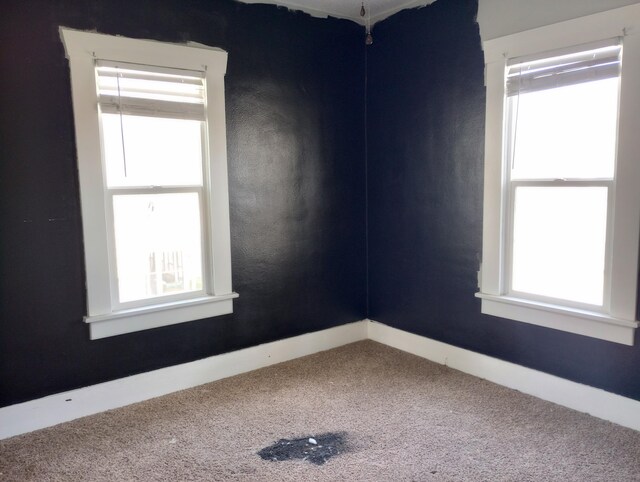 215 N Central Ave, Monett, MO 65708 - unfurnished room with baseboards and carpet