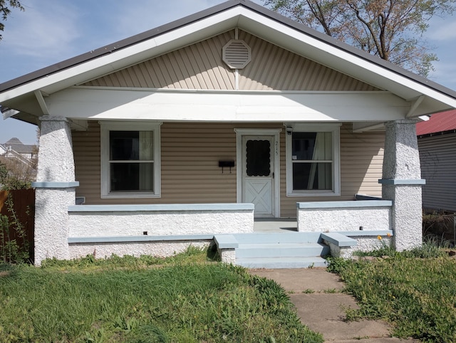 215 N Central Ave, Monett, MO 65708 - bungalow-style house featuring a porch