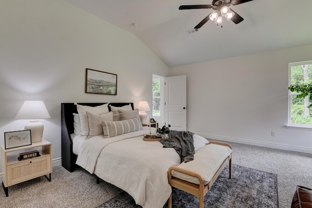 bedroom with baseboards, visible vents, lofted ceiling, and light colored carpet
