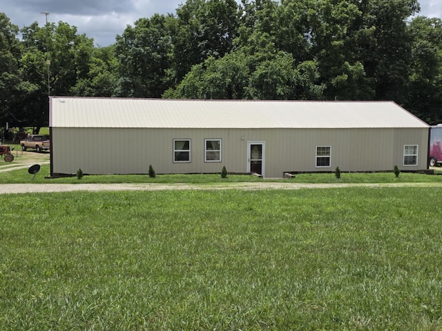 1978 E 473rd Rd, Halfway, MO 65663 - view of front of house featuring a front lawn, a pole building, an outdoor structure, and a metal roof