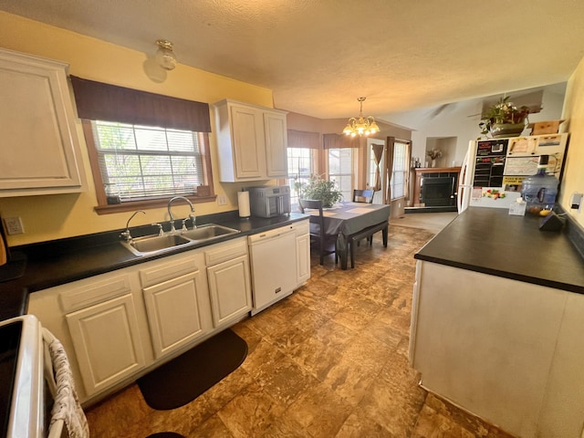 418 N Harrington Dr, Republic, MO 65738 - kitchen with dark countertops, white dishwasher, a sink, range, and white cabinets