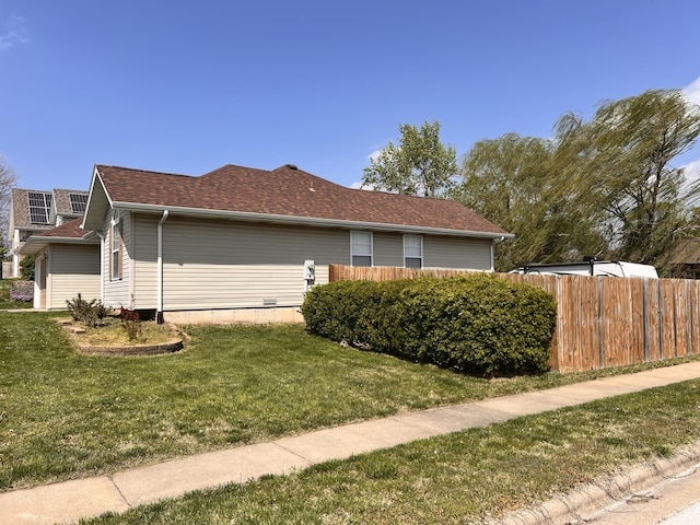 418 N Harrington Dr, Republic, MO 65738 - view of side of home featuring fence, a shingled roof, and a yard