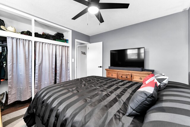 bedroom with wood finished floors and ceiling fan