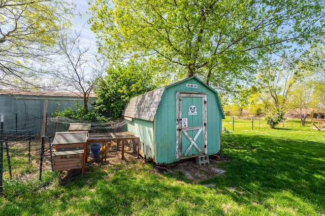 view of shed featuring fence