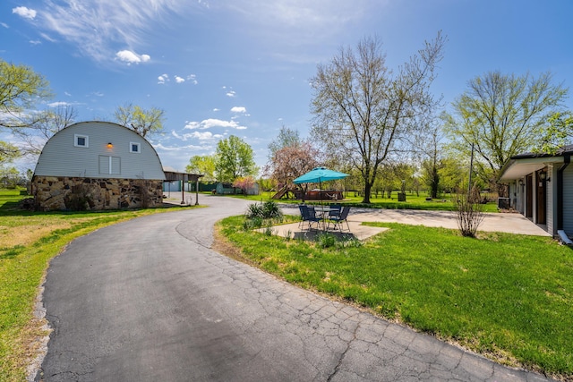 view of home's community featuring a yard