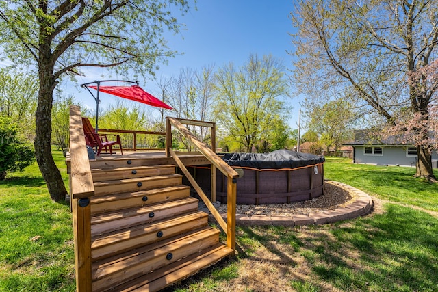 wooden terrace featuring stairway, a covered pool, and a yard