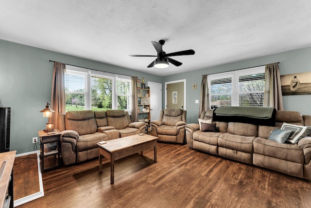 living area featuring wood finished floors and ceiling fan