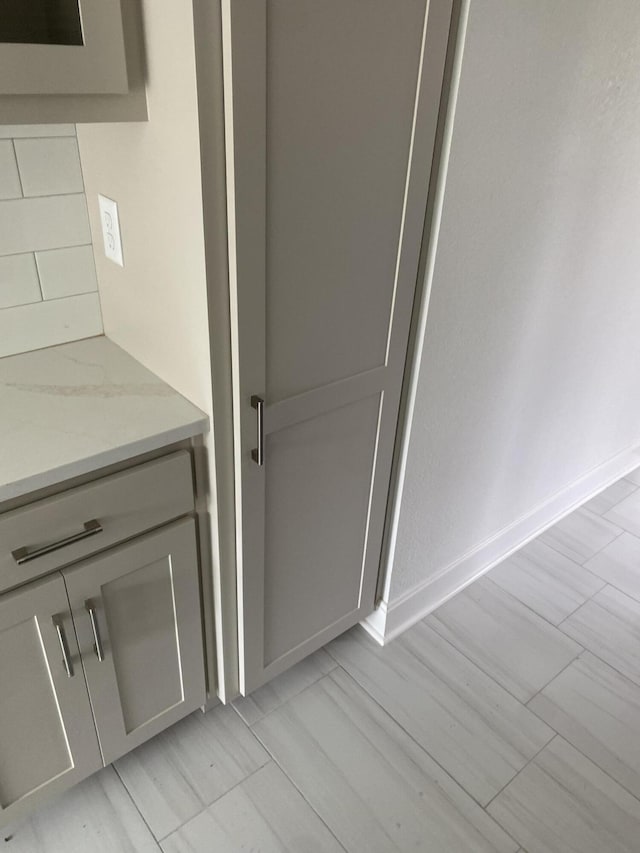 601 E 77th St, Kansas City, MO 64131 - bathroom with vanity and decorative backsplash