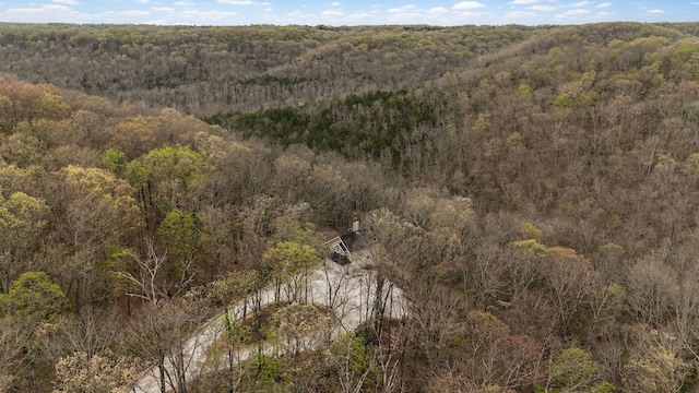 birds eye view of property with a wooded view