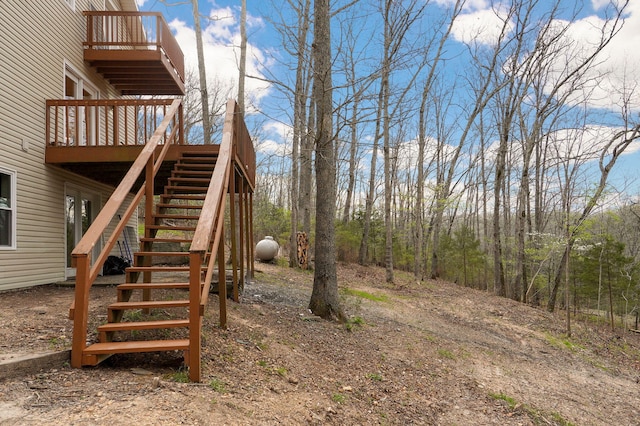 view of yard with stairs and a deck