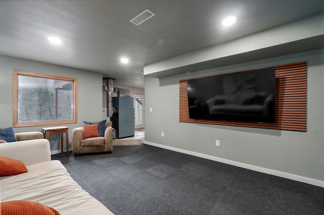 living room featuring recessed lighting, dark carpet, visible vents, and baseboards