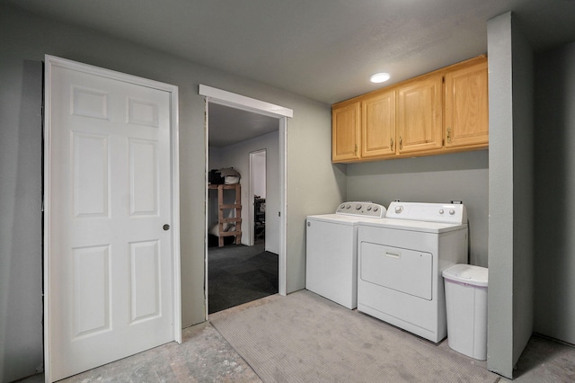 laundry area with cabinet space and washer and clothes dryer