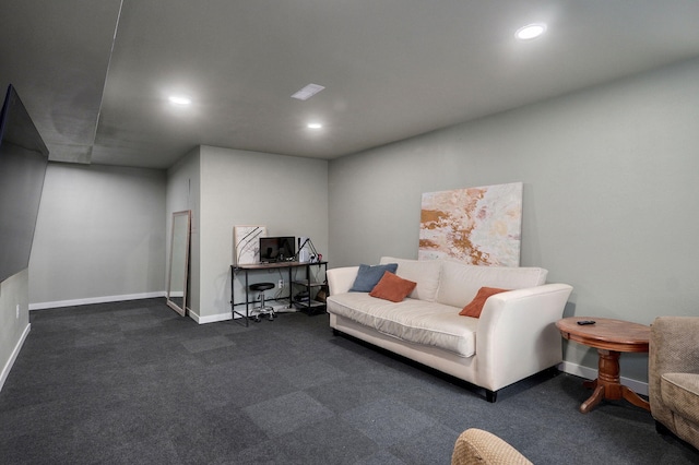 living room featuring baseboards, dark carpet, and recessed lighting