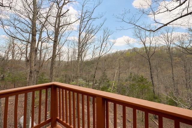 wooden deck featuring a wooded view