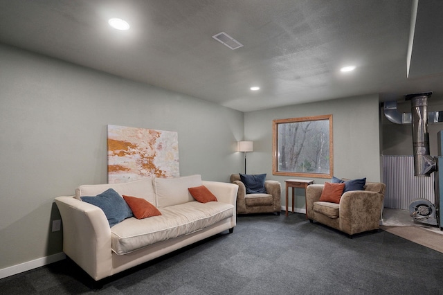 living area with baseboards, carpet flooring, visible vents, and recessed lighting
