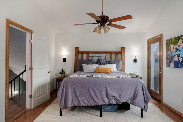 bedroom with lofted ceiling, wood finished floors, and ceiling fan