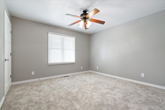 101 Poindexter Dr, Pineville, MO 64856 - spare room with baseboards, visible vents, carpet, and ceiling fan