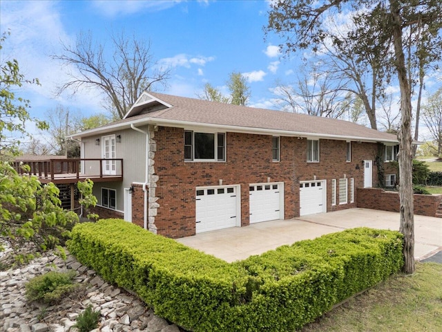 101 Poindexter Dr, Pineville, MO 64856 - view of property exterior with a wooden deck, driveway, brick siding, and a garage